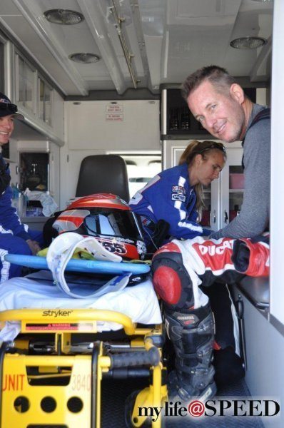 This photo is from the last test after I crashed. Paul Livingston, Spider Grips Ducati, took the photo and was glad to see me smiling after the incident. The paramedic is laughing at Paul making a comment, "you know that was an expensive helmet...".