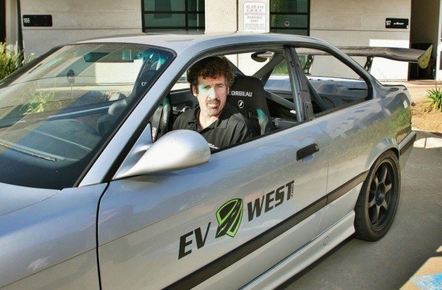 Boris Said test fitting the cockpit of the EV West Pikes Peak BMW