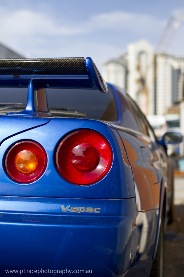 Car heaven - R34 Nissan GT-R in bayside blue - Rear three-quarter close-up shot 1