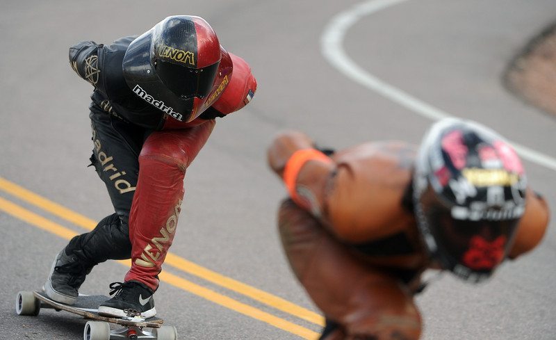 Winner Zac Maytum, left, gets ready to blast past second-place rider Jimmy Riha, right, as the two round the second to last turn in the race. Photo by Helen H. Richardson/The Denver Post