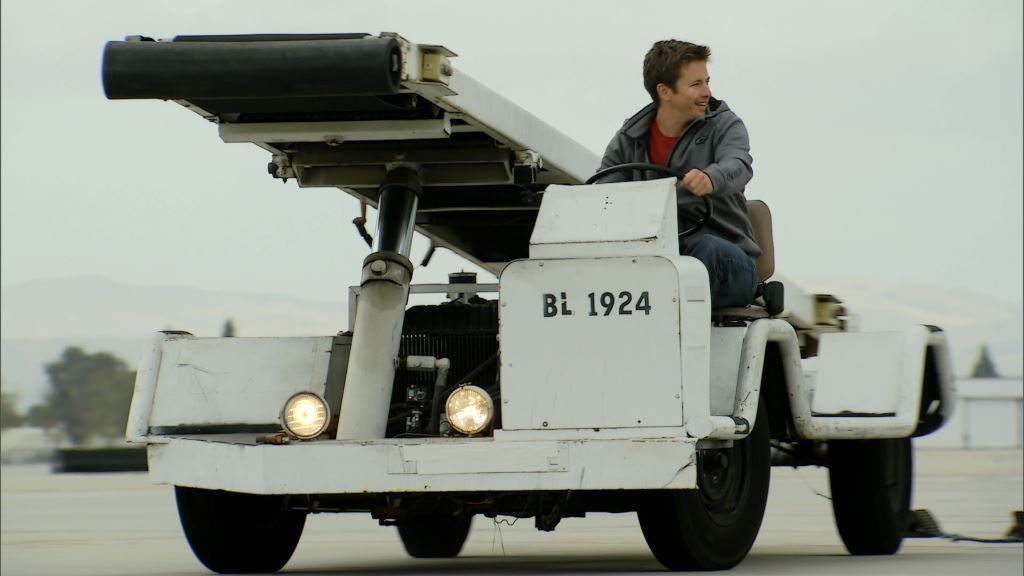 Tanner driving a baggage conveyor truck at Ontario Airport. (Photo Credit: Tobia Sempi © 2013 BBC Worldwide Ltd. “All Rights Reserved”)