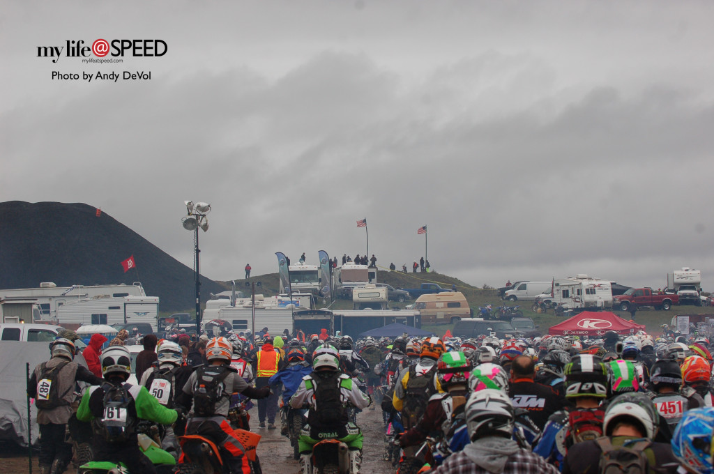 The two flags at the top of the hill are the flags on the 12 foot wide gate which all riders have to navigate through after the start. 