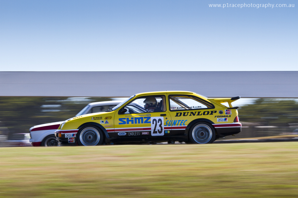 Phillip Island Classic 2014 - Sunday - Chris Bowden - Shimz Ford Sierra RS 500 Group A - Justin Matthews - 1982 Ford Escort MK II Group C - Turn 10 entry - profile pan 1