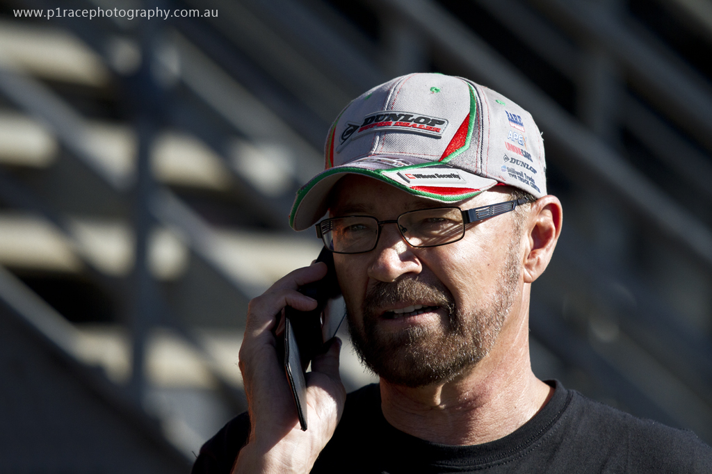 Phillip Island Classic 2014 - Sunday - Pits - John Bowe talking on phone 3