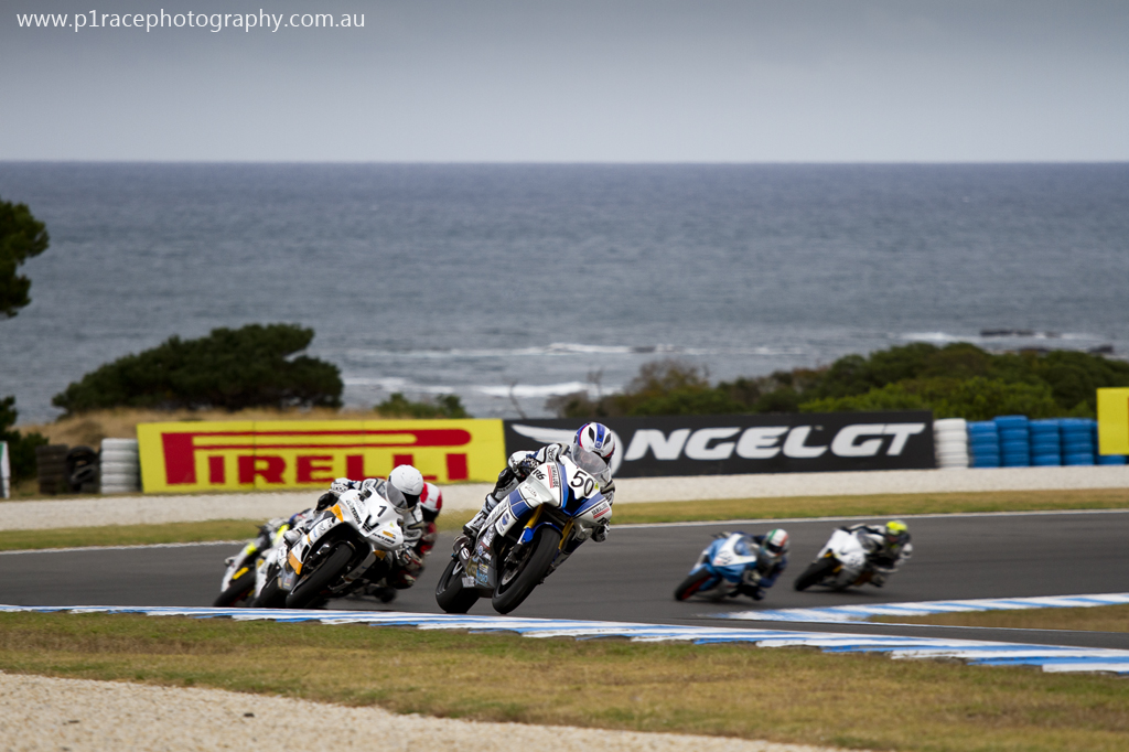 WSBK 2014 - Round 1 - Phillip Island - Saturday - Australian Supersport Race 1 - Callum Springs - Daniel Falzon - Yamaha RZF-R6 - Turn 6 exit - front three-quarter pan 2