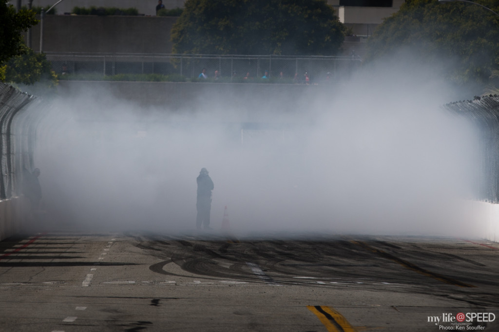 Warming the tires on the starting line leaves copious amounts of smoke.