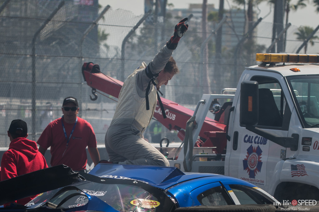 Kyle Mohan lets the crowd know he's OK after his spectacular crash in turn 10.