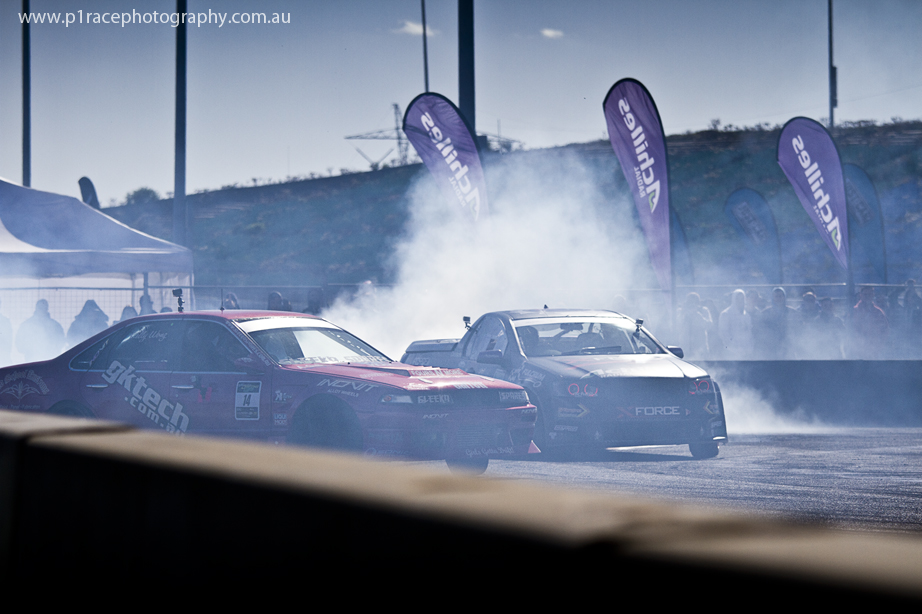 ADGP 2014 Final - Calder Park - Kelly Wong - Nissan Cefiro - Nick Coulson - VE Holden Commodore ute - Final turn exit - front three-quarter shot 1