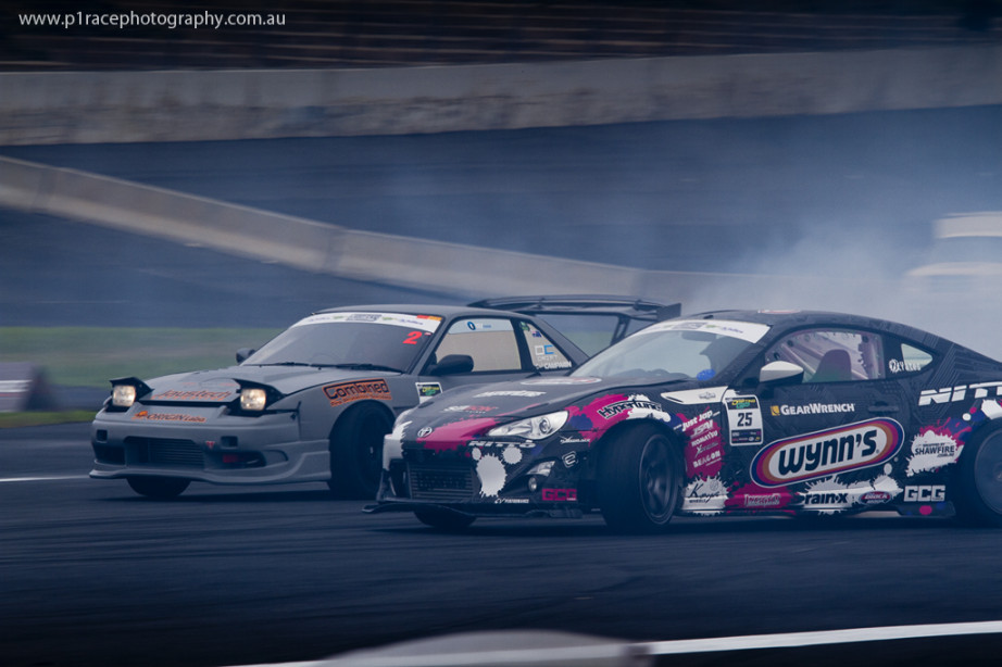 ADGP 2014 Finals - Calder Park - Beau Yates - Toyota ZN6 - Dale Campaign - Nissan S13 Sileighty - Turn 2 approach - front three-quarter pan 2