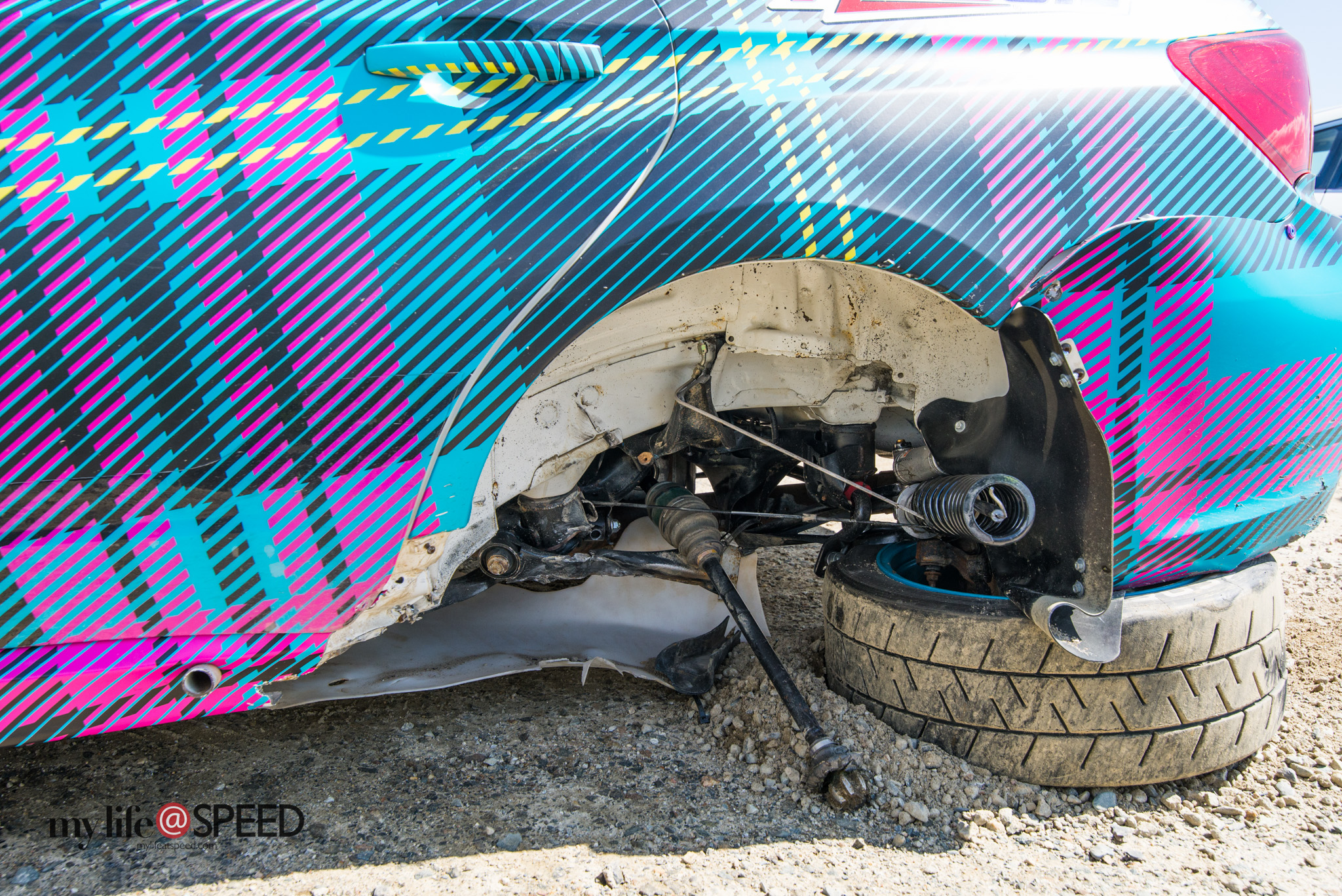202 Nick Roberts 2014 Subaru STI with a ripped off left rear wheel after swinging it too wide at Cragway Corner and hitting a boulder on Day 2 Practice. here's a closer look at the aftermath.