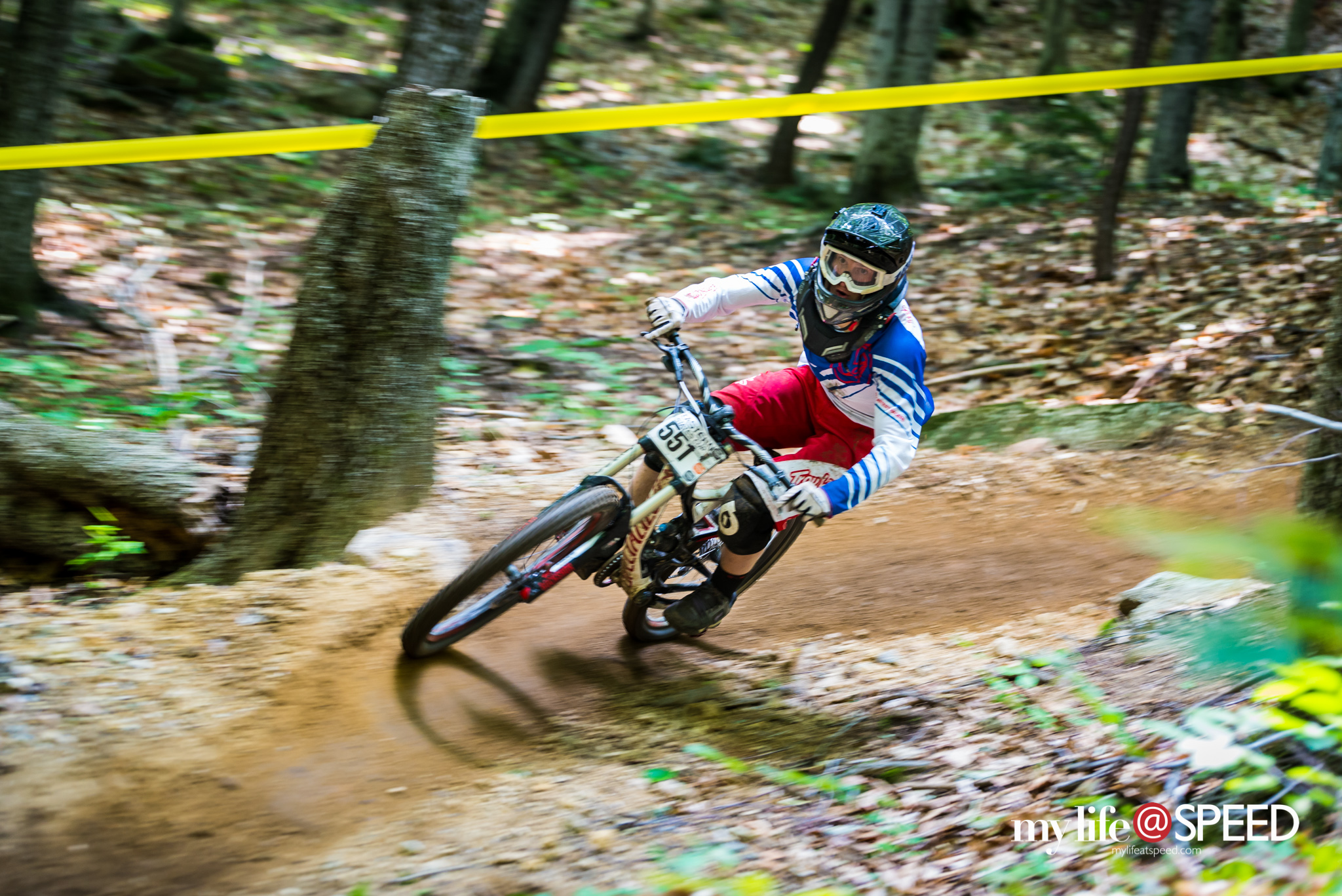 unknown racer digging into the many berms found on course  