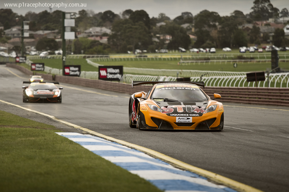 V8 Supercars 2014 - Sandown 500 - Friday - Australian GT - Klark Quinn - McLaren MP4-12C GT3 - Turn 1 approach - Front three-quarter shot 1