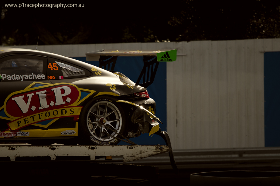 V8 Supercars 2014 - Sandown 500 - Sunday - Porsche Carrera Cup - Duvashen Padayachee - VIP Petfoods - Post-crash rear three-quarter - flatbed shot 2