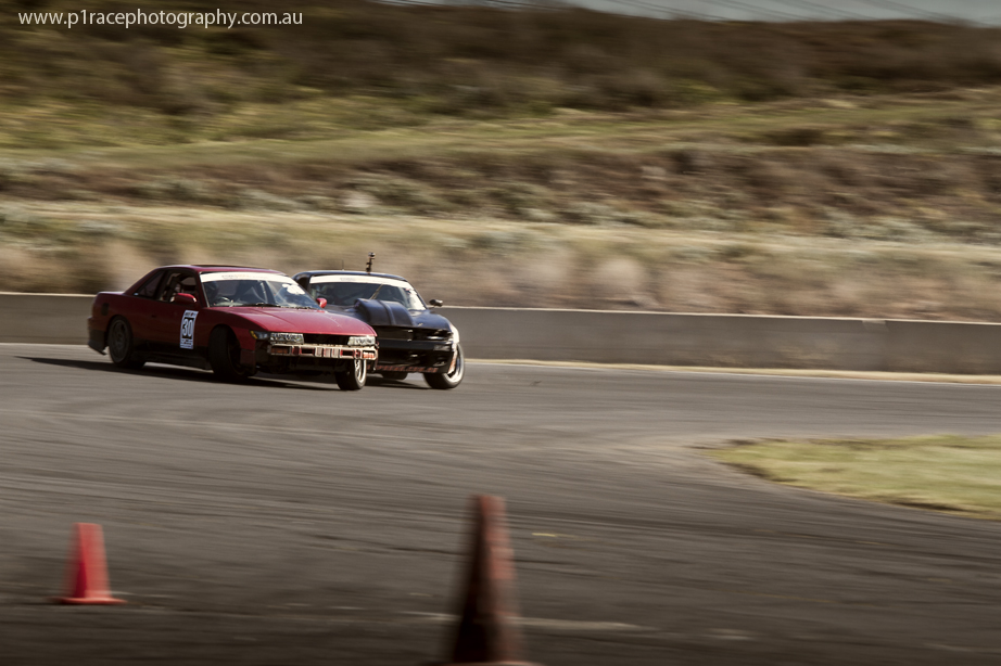 VicDrift 2014 - Round 5 - Sean Power - Red and black S13 Nissan Silvia - Michael Prosenik - V8 S13 - Turn 1 entry - Front three-quarter pan 1