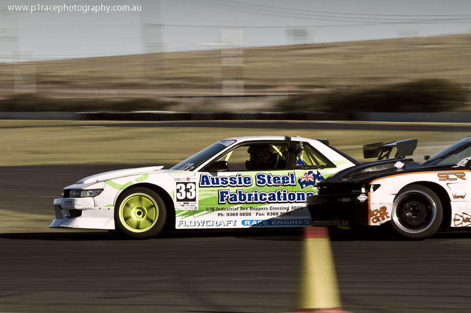 VicDrift 2014 - Round 5 - Tom Sabo - White S13 V8 Nissan Silvia - Michael Prosenik - Final turn exit - Profile pan 1