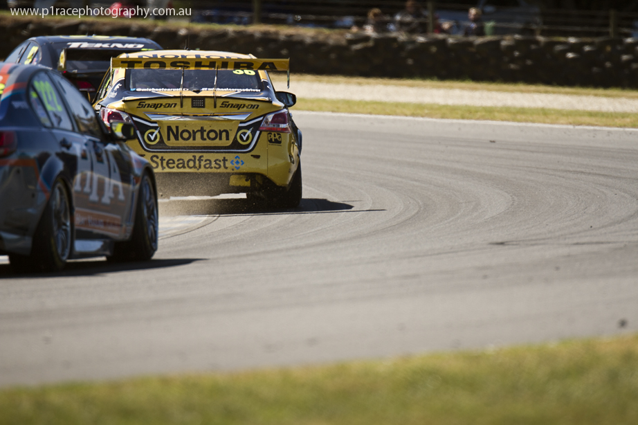 V8 Supercars 2014 - Phillip Island 400 - Sunday - Race 35 - Michael Caruso - Nissan Altima - Turn 11 apex - Rear shot 1