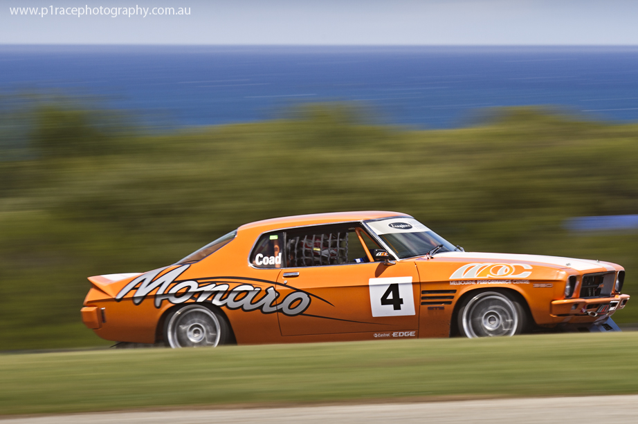 V8 Supercars 2014 - Phillip Island 400 - Sunday - Sports GT - Steve Coad - Orange HQ Holden Monaro GTS 350 - Turn 9 exit - Front three-quarter pan 1