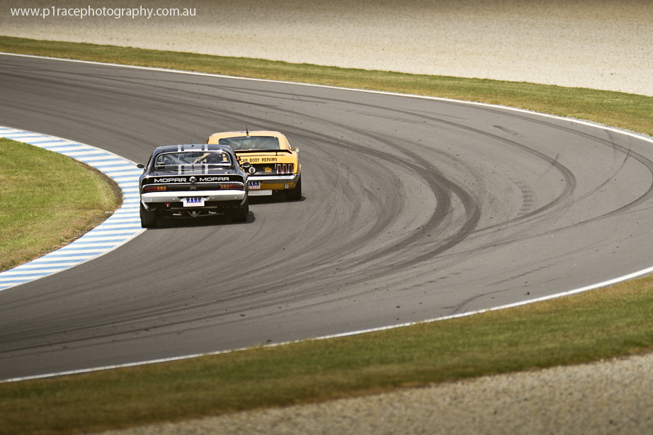 V8 Supercars 2014 - Phillip Island 400 - Sunday - Touring Car Masters - Greg Crick - Mopar Charger E55 - Tony Karanfilovsky - Mustang Trans-Am - Turn 12 apex - Rear shot 1