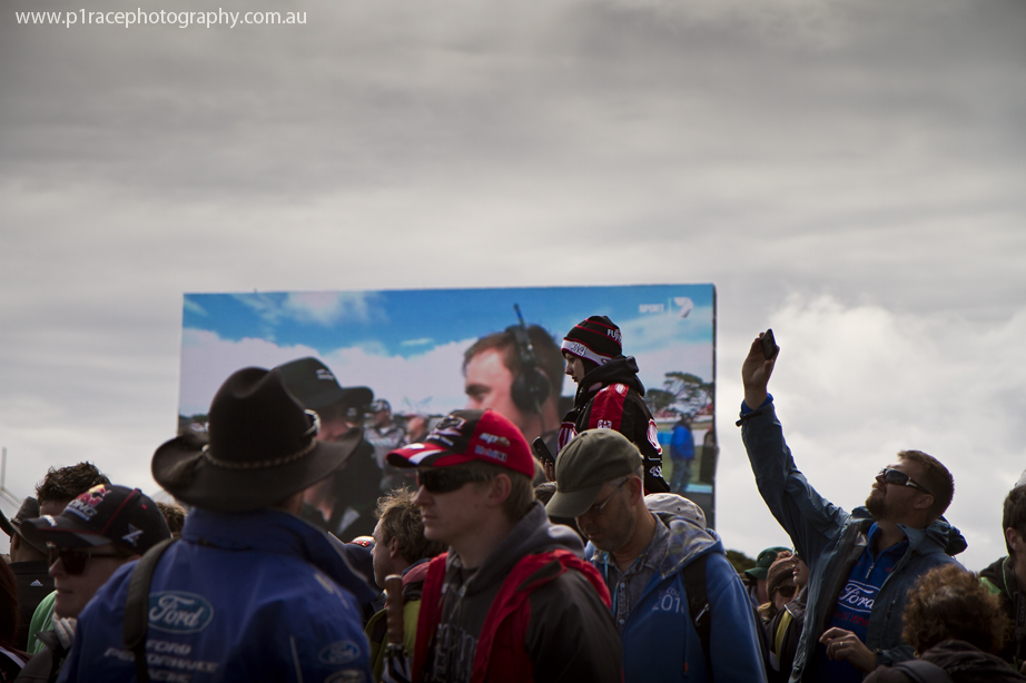 V8 Supercars 2014 - Phillip Island 400 - Sunday - Track Walk - Girl wearing Lockwood Racing clothing on partner shoulders 1