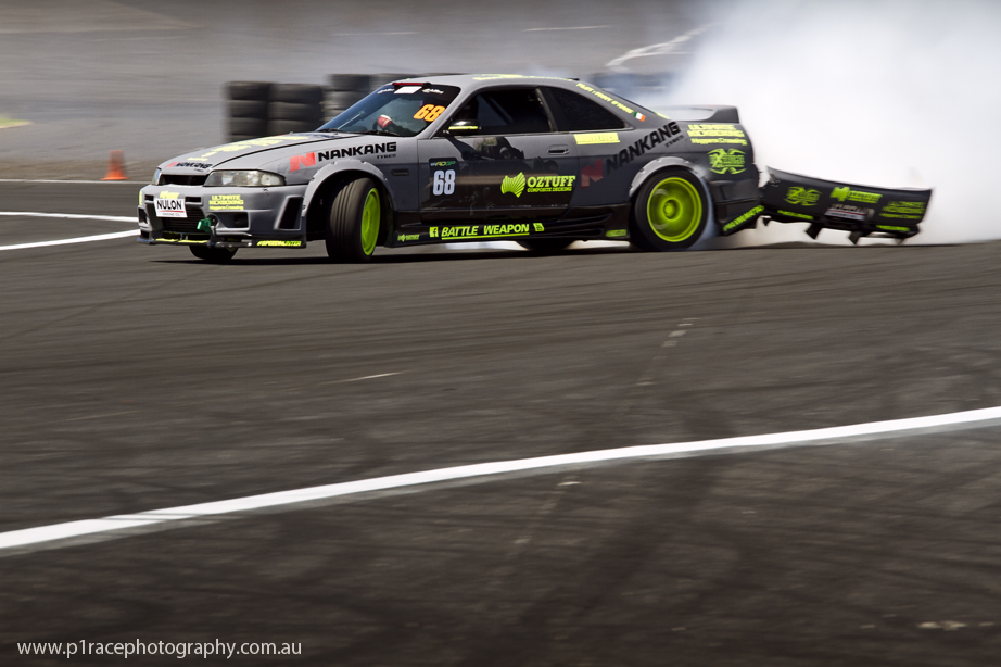 ADGP 2014-15 - Round 2 - Melbourne - Finny OHare - R33 Nissan Skyline GTS-t - Horseshoe exit - Front three-quarter pan 1