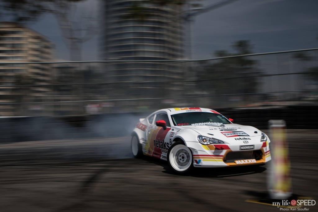 Ryan Tuerck blasting through the hairpin with downtown Long Beach in the background.