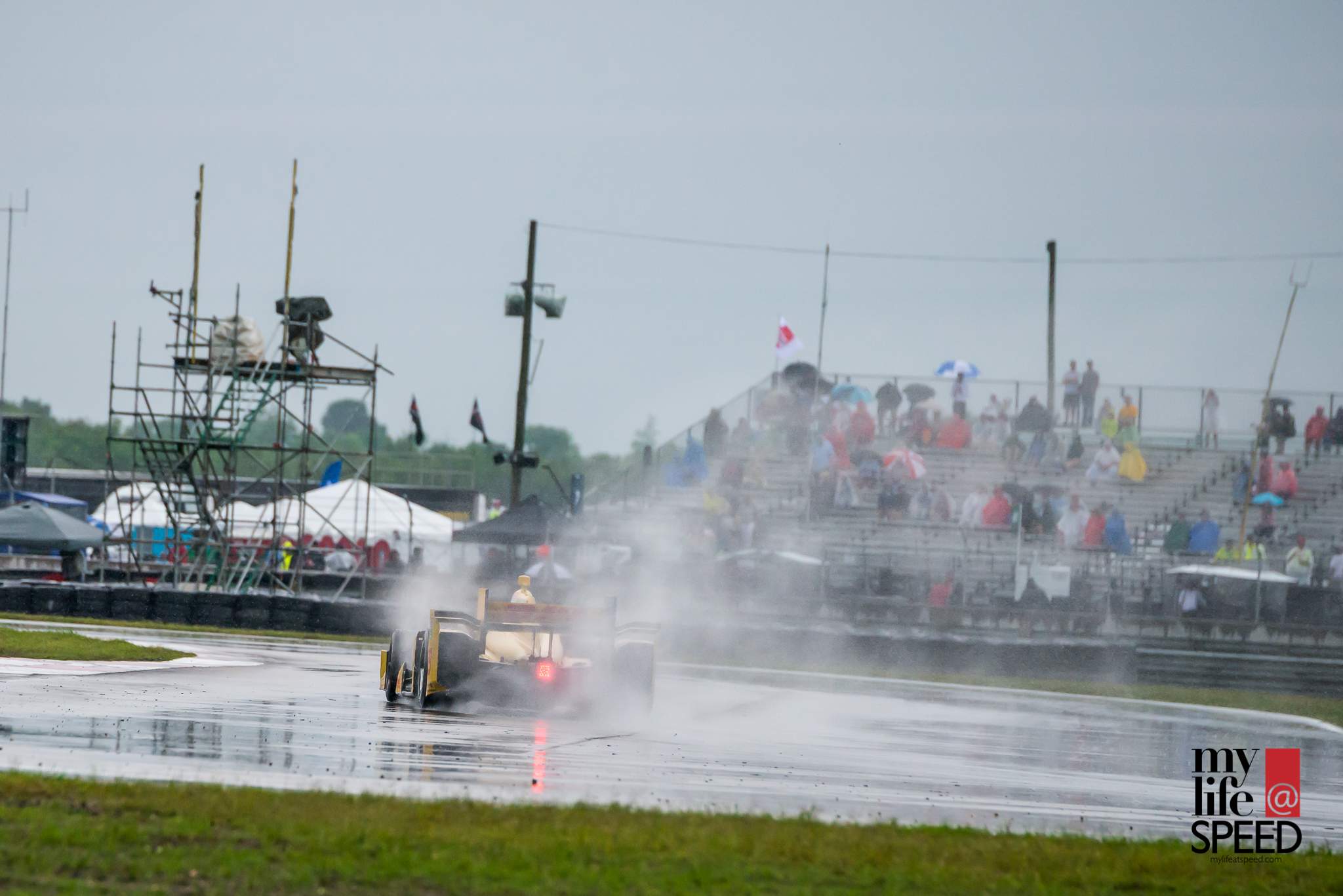 Ryan Hunter-Reay attacking the wet pavement.