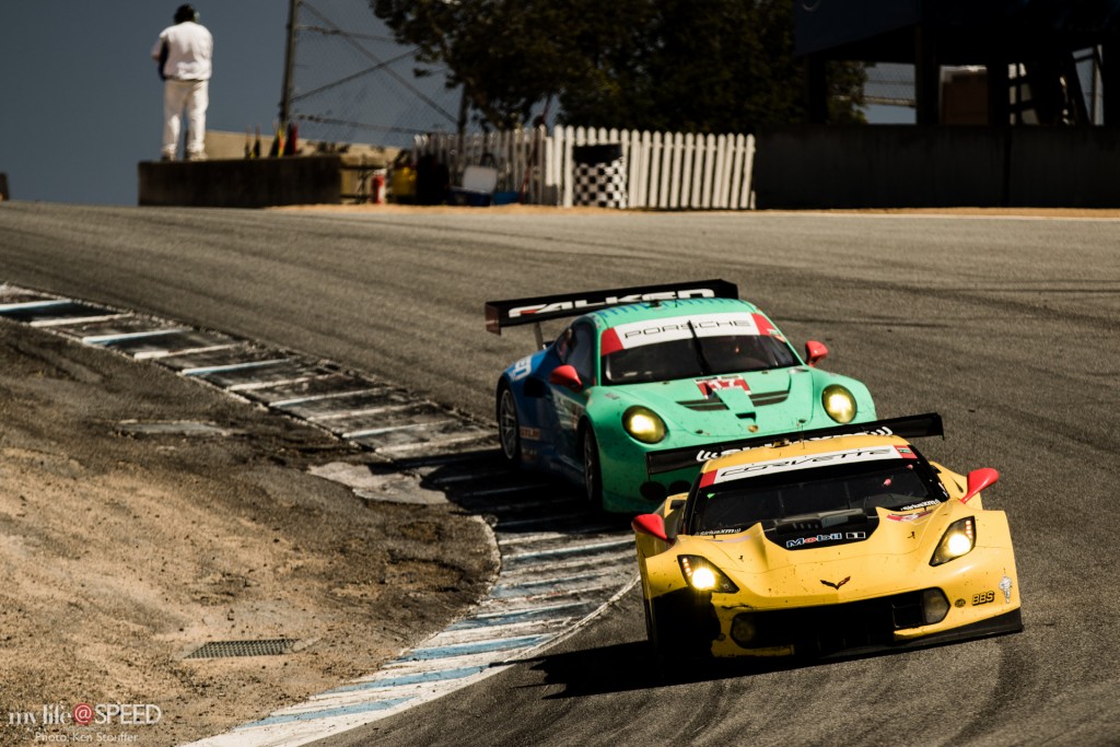 The No. 3 Corvette leads the Team Falken Tire Porsche down through the Corkscrew