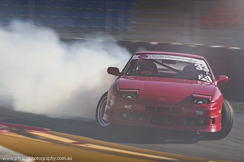 VicDrift Round 1 2015 - Scott Dickie - Red S13 Onevia - Wall exit - Front three-quarter pan 4
